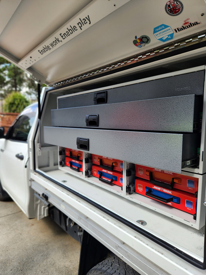 Rolacase Open tool box with tools inside, showing a close-up of the interior.